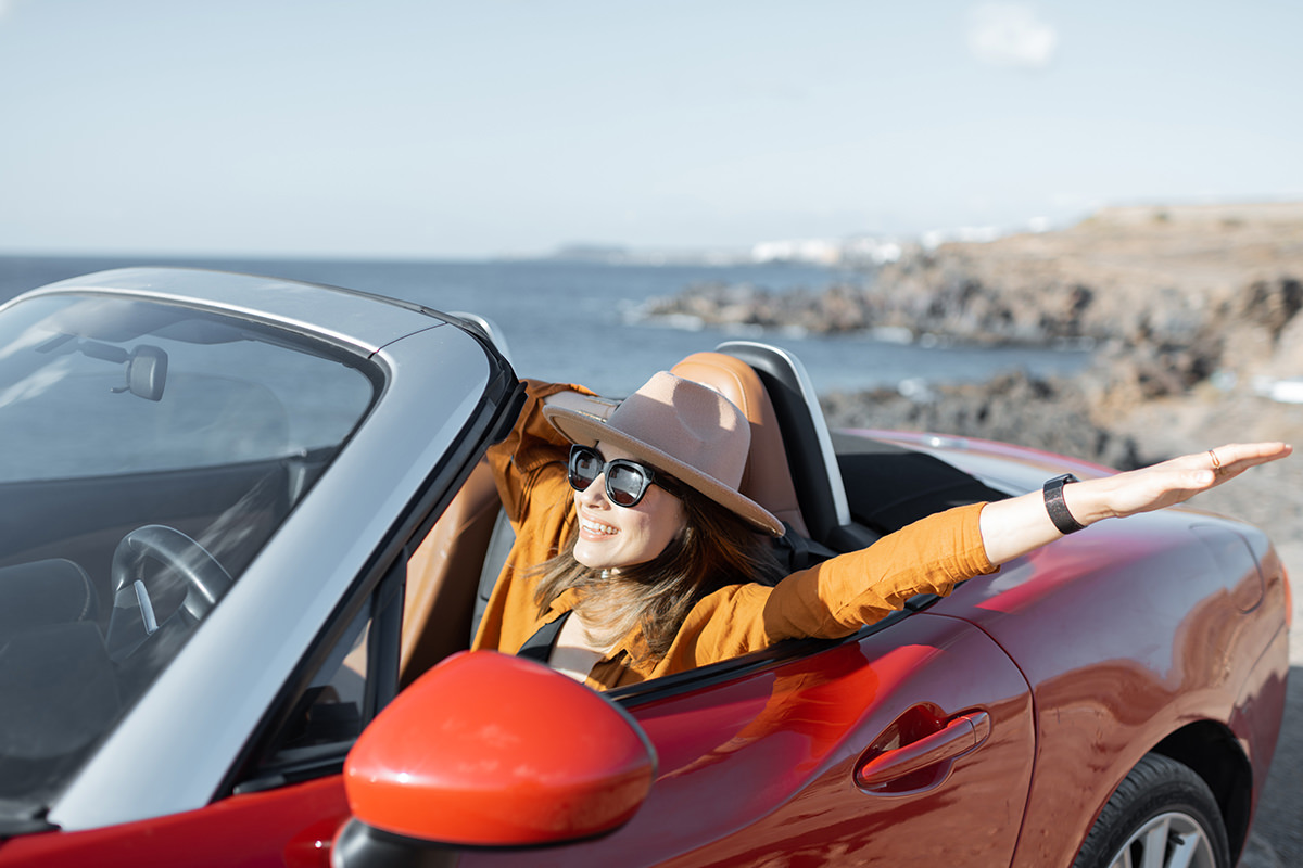 woman in convertible car driving